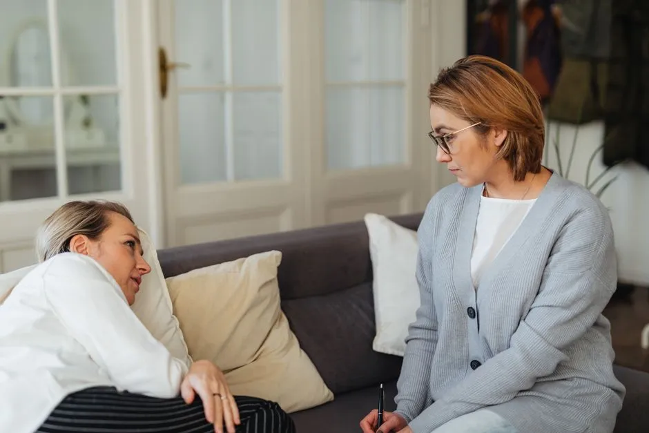 Illustrative photo of a therapist and client in conversation during a counseling session